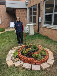 Maria with the spiral garden she created as part of her Eagle Scout project.