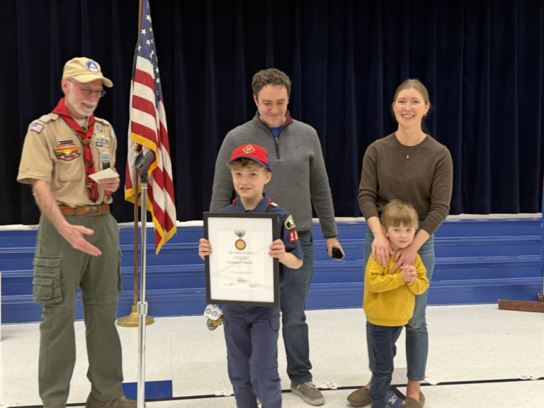 Nate receiving Medal of Merit